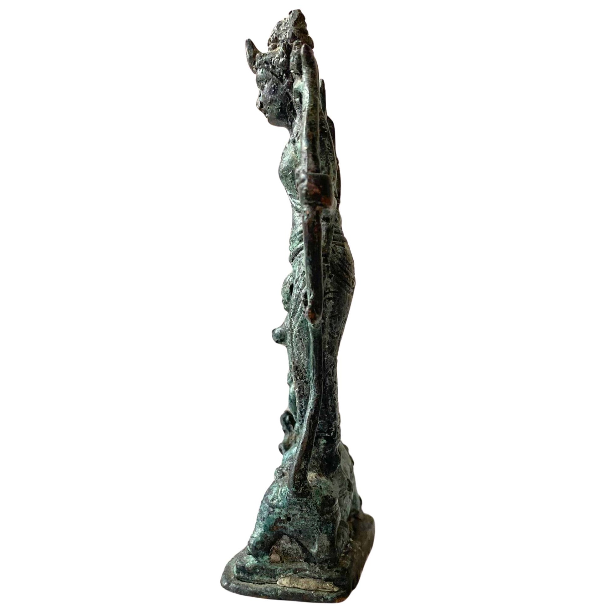 Close-up of the crusty green malachite deposit on the old bronze.