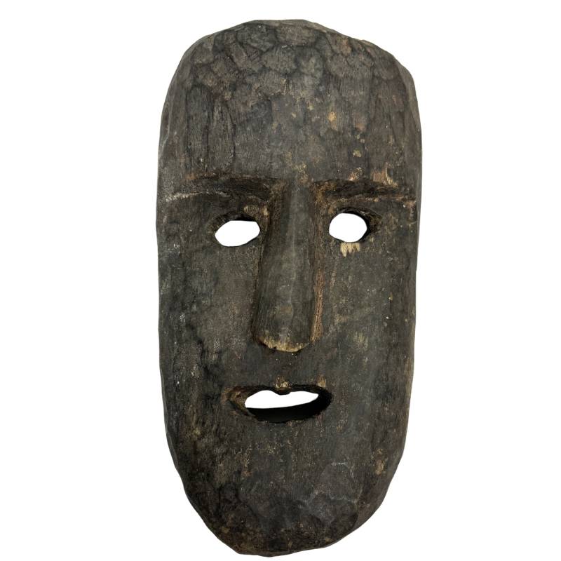 Nepalese wooden ritual mask made of hand-carved wood with a natural patina