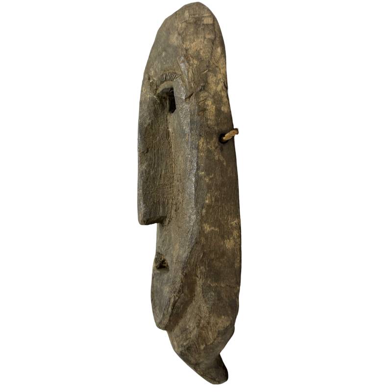 Nepalese wooden ritual mask with shell inlay and aged appearance