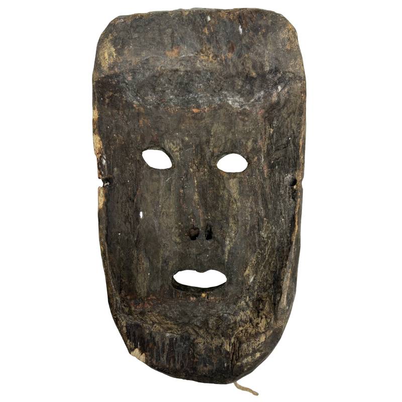 Nepalese wooden mask with a serene expression and aged patina
