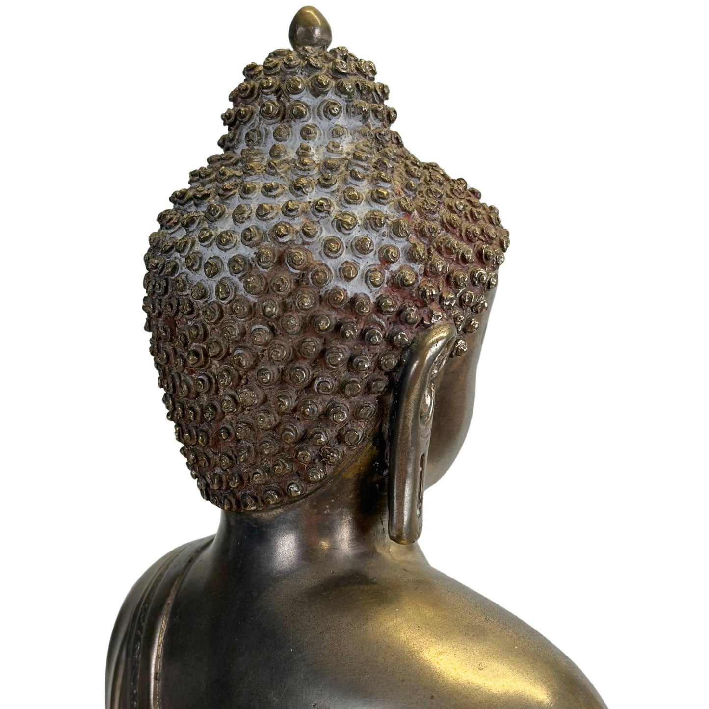 Detail of the ushnisha and hand-shaped hair curls of an antique Newar Bhaisajyaguru in silver-plated bronze, with natural wear, old patina, and remnants of ritual use.