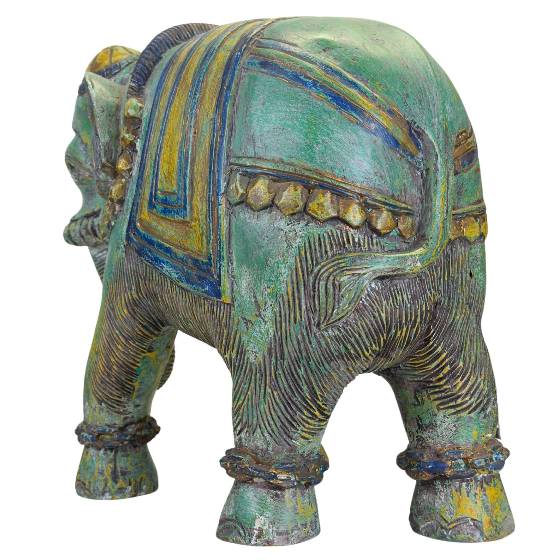 Indian elephant with richly decorated ceremonial blanket and headdress