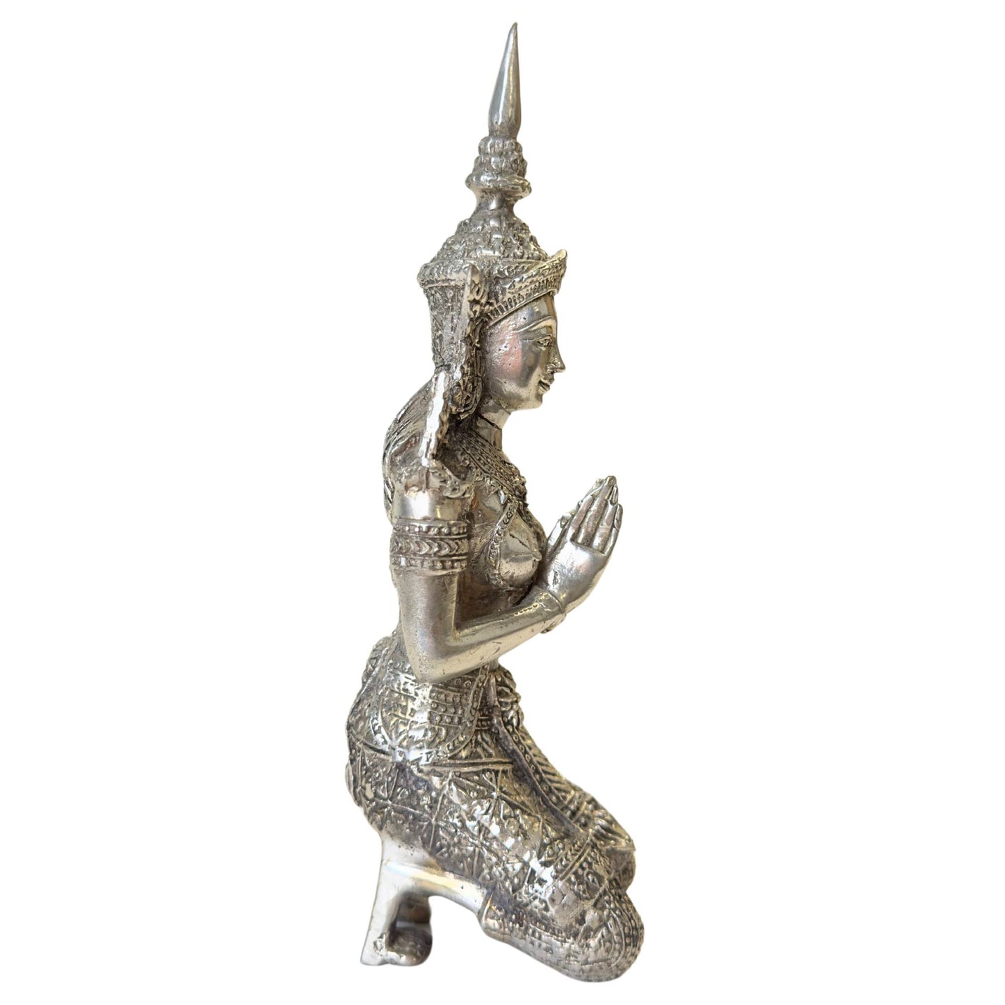 The underside of the silver-plated Thepanom statues with casting marks.
