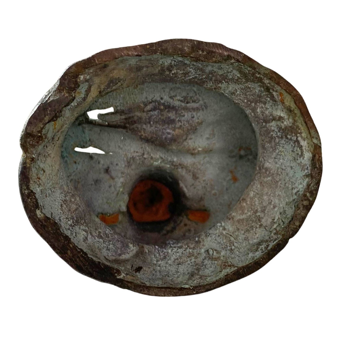 Forensic photograph of the hollow underside with authentic clay casting core and cooling crack