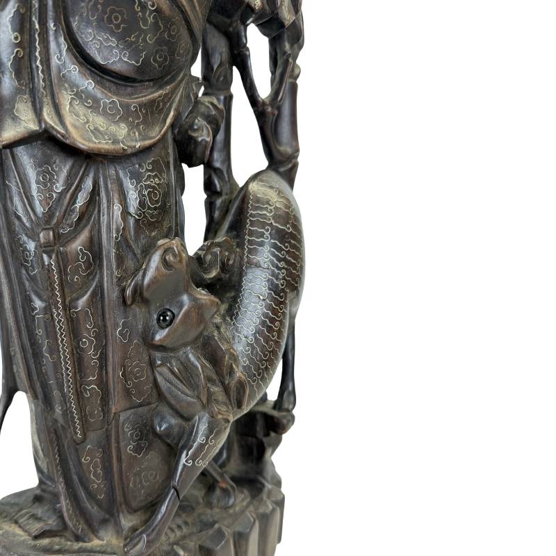 Chinese statue of the immortal Magu with a deer and bamboo, a symbol of good fortune.
