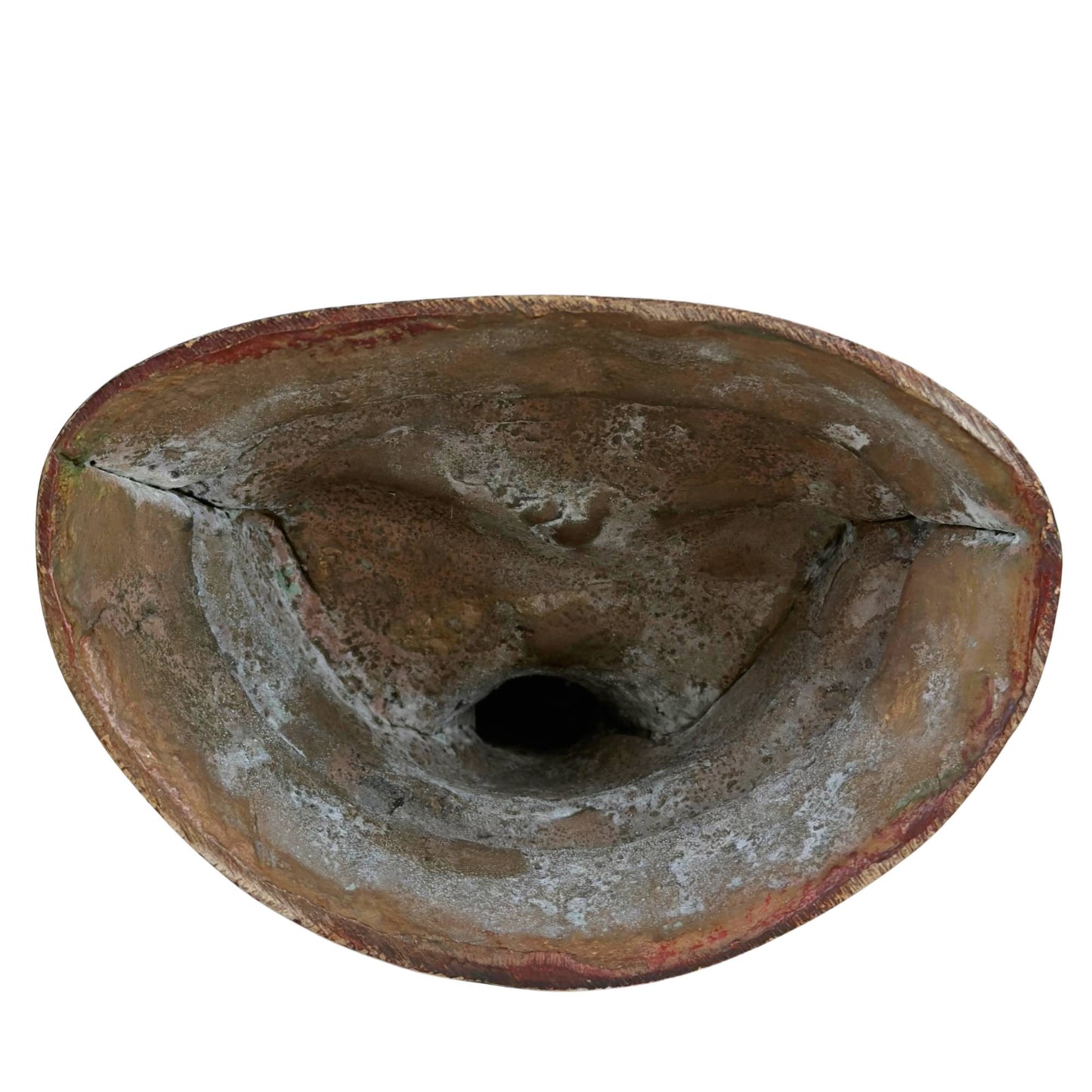 Open underside of Vajrasattva statue with rough casting texture, oxidation, and remnants of traditional bronze casting.
