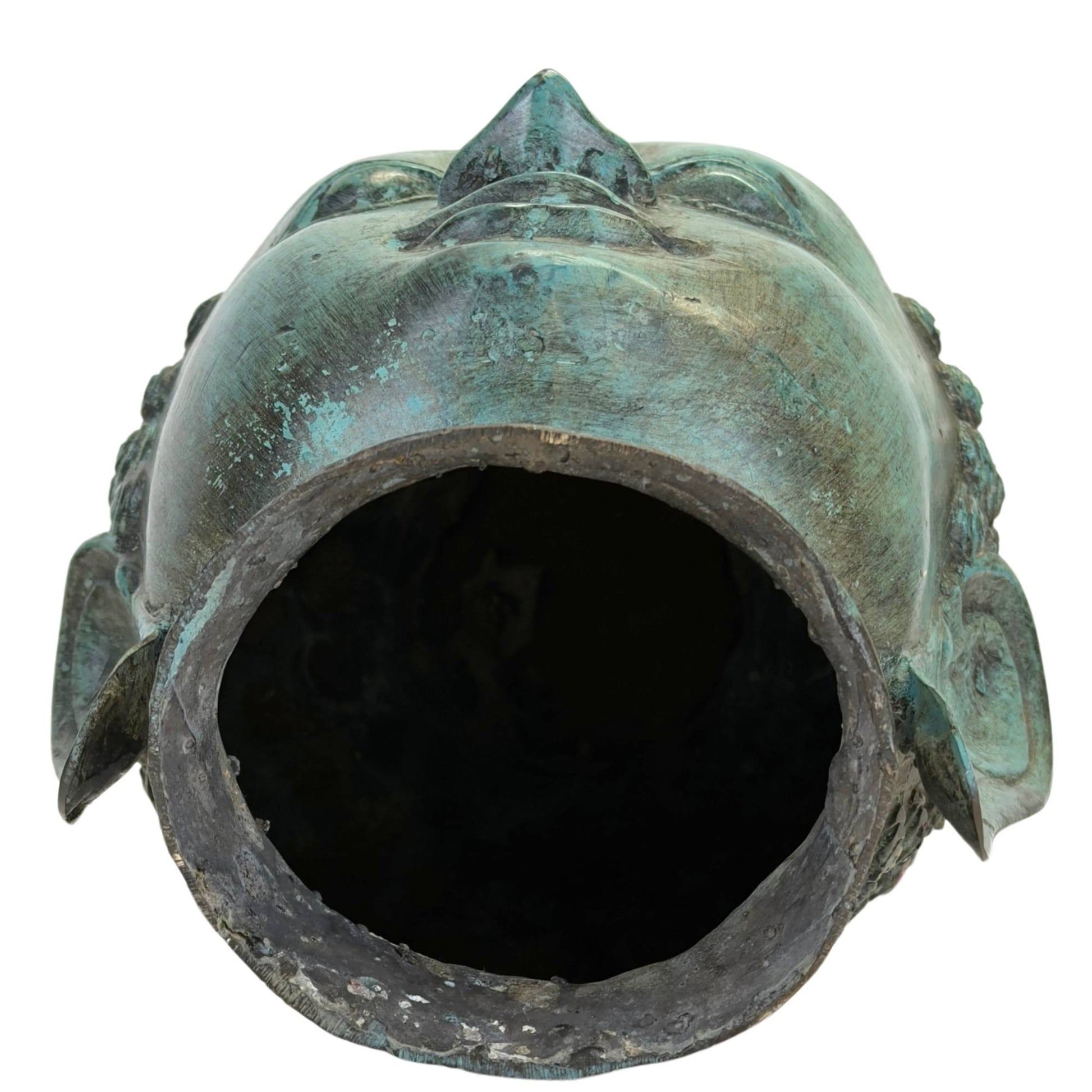 Open underside of bronze Buddha head with visible casting technique