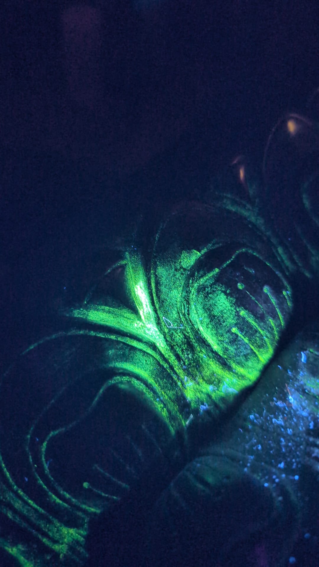 Organic traces ritual use metal historical evidence temple service Buddhism. with UV lamp