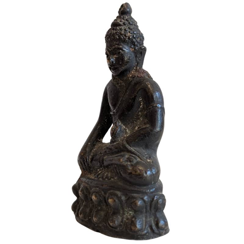 Old Buddhist travel statue with kalasha