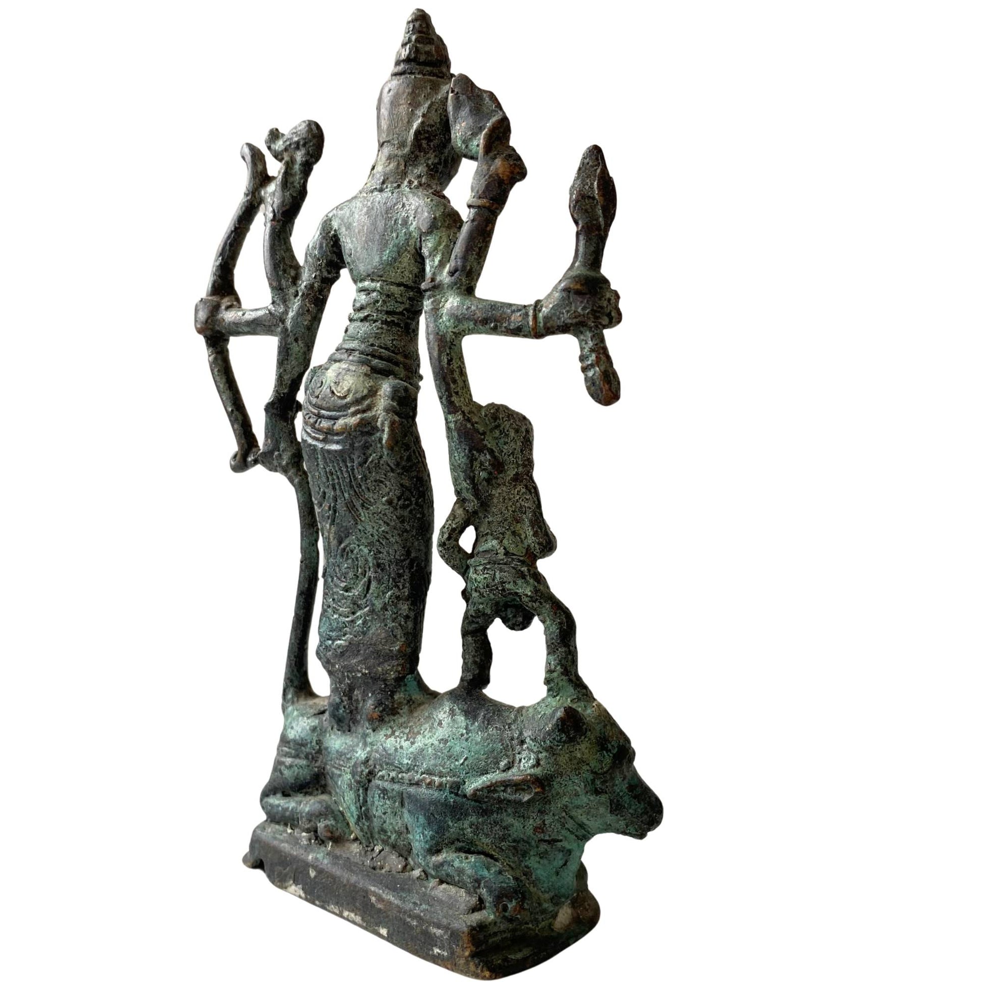 The back of the sculpture shows the layered oxidation and crusty patina.
