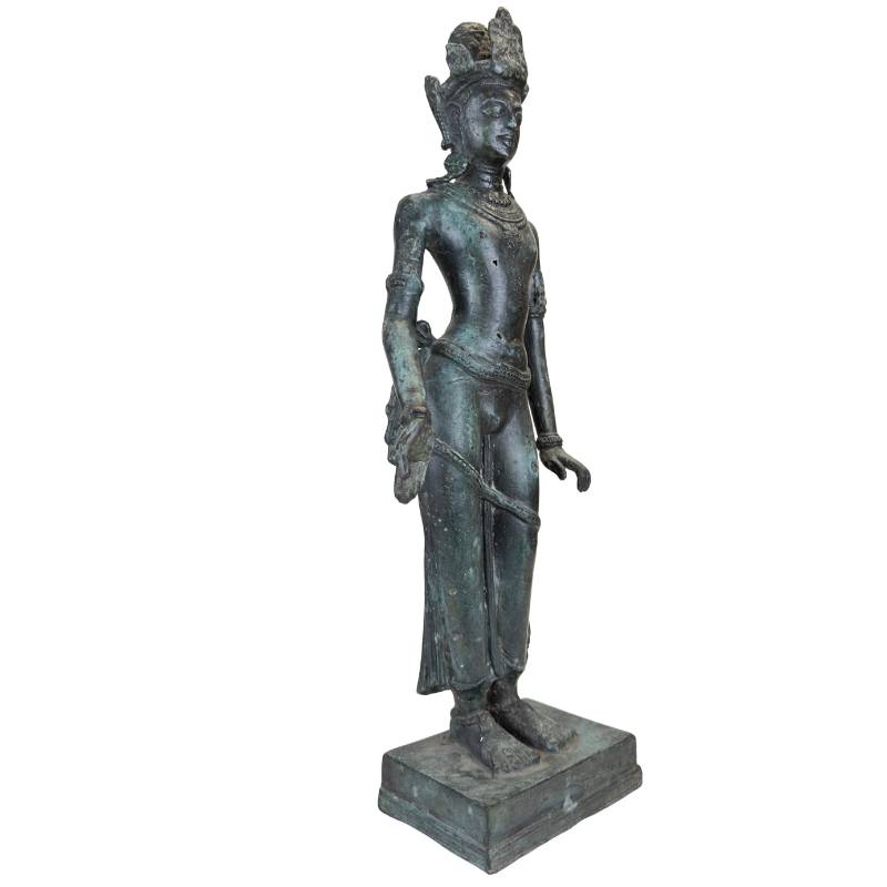 Old bronze statue of an Asian temple figure with natural patina