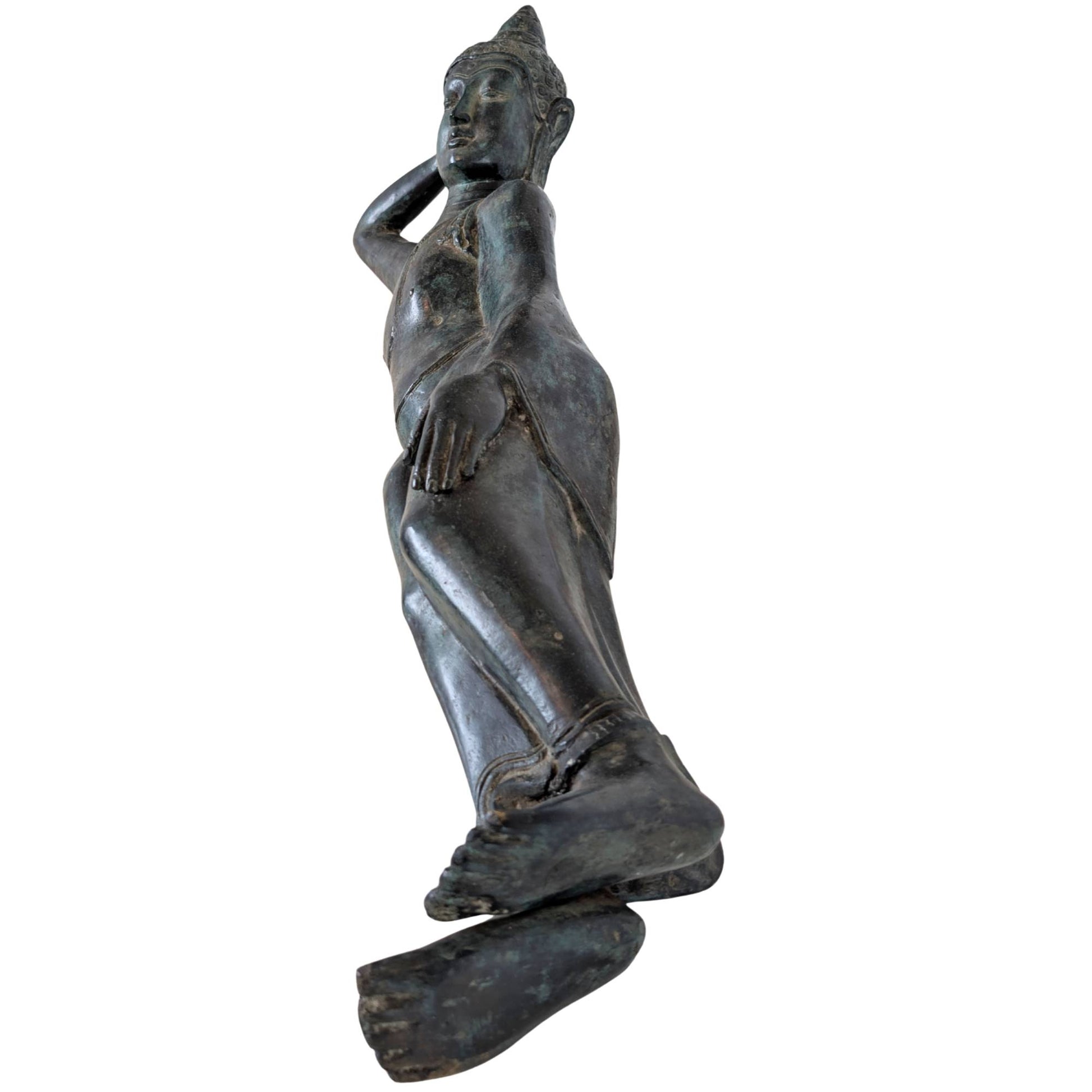 Surface of an antique bronze Buddha statue with authentic patina and signs of use