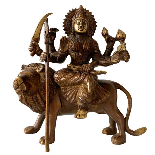 old bronze Durga statue on a lion – Hindu goddess of strength and protection