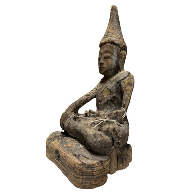 Old wooden Buddha statue with inventory number and collection or export stamp under the base