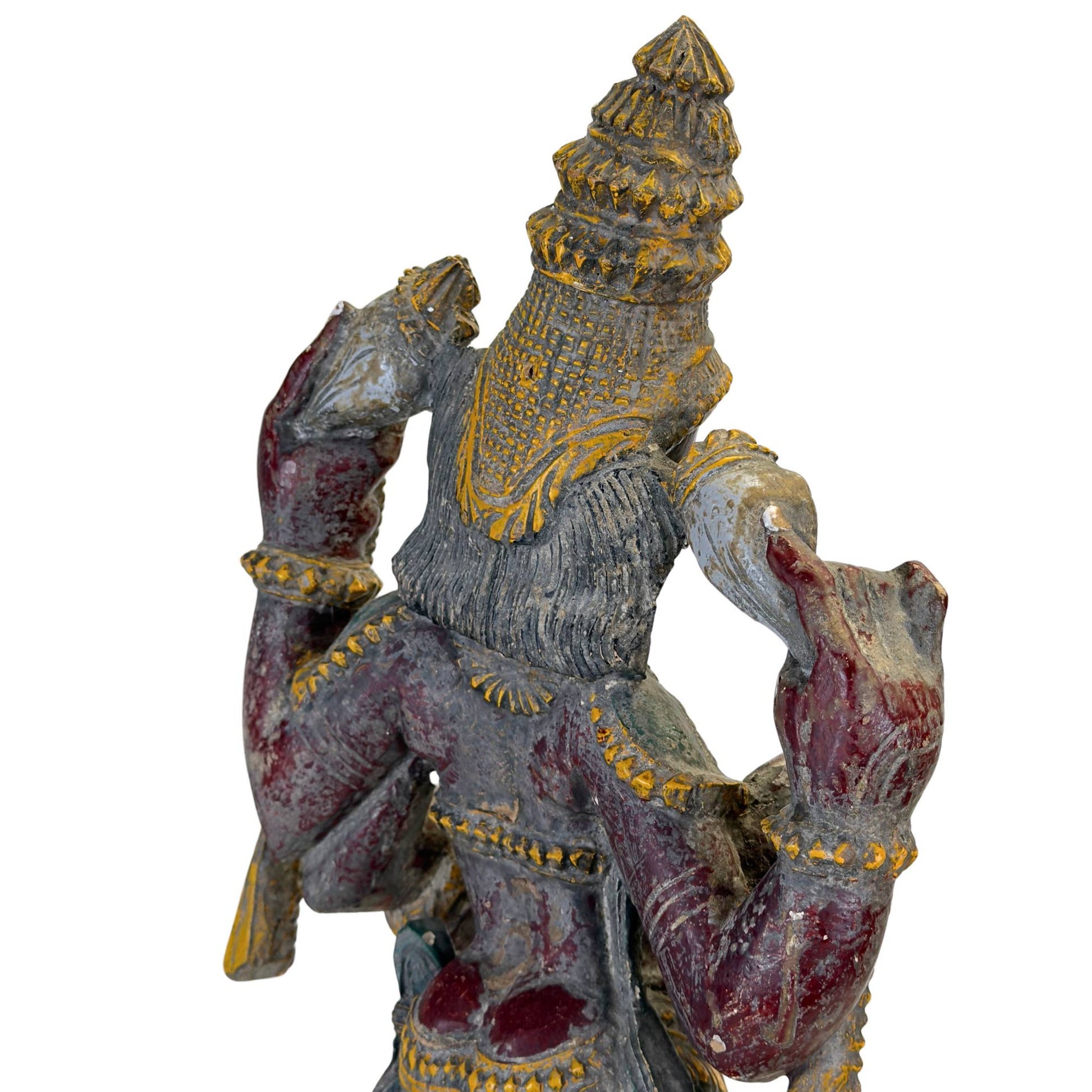 Old Indian wooden Vishnu statue with polychrome painting