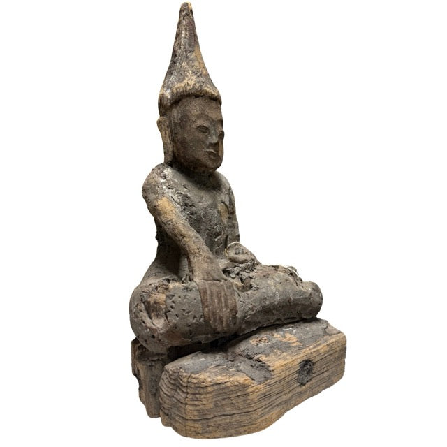 Old Burmese Buddha made of wood with weathered patina and deep spiritual appearance