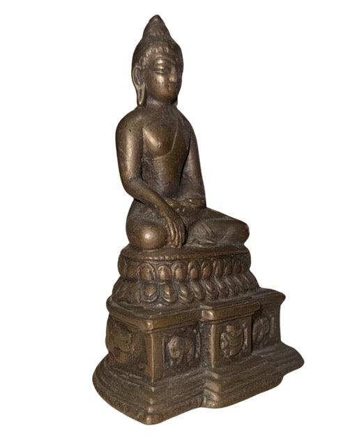 Old bronze Buddha on lotus throne with classical bhumisparsha mudra