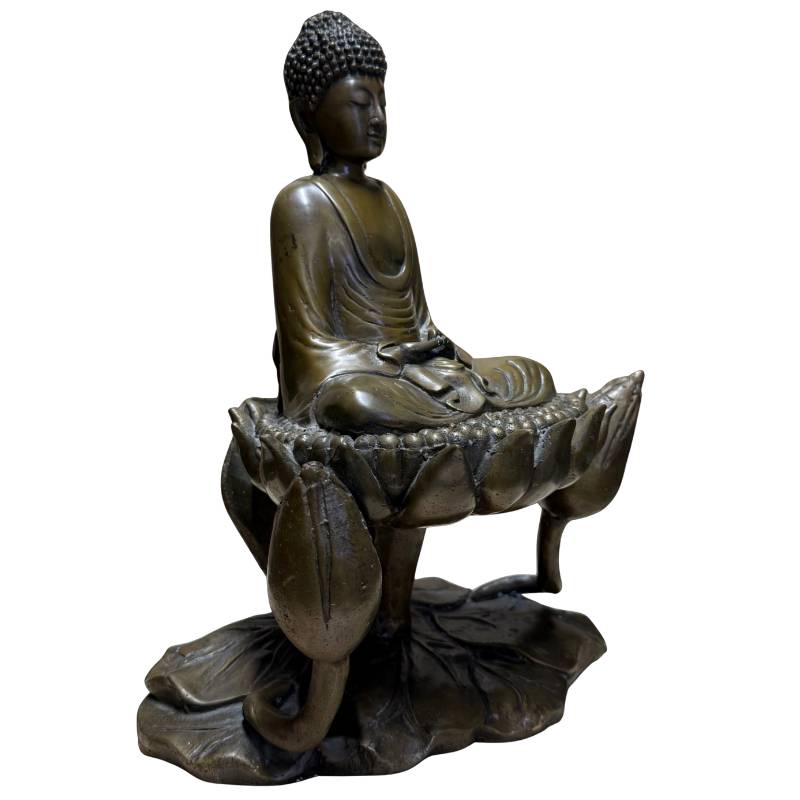 Old bronze Buddha on a lotus seat with meaning of purity and spiritual growth