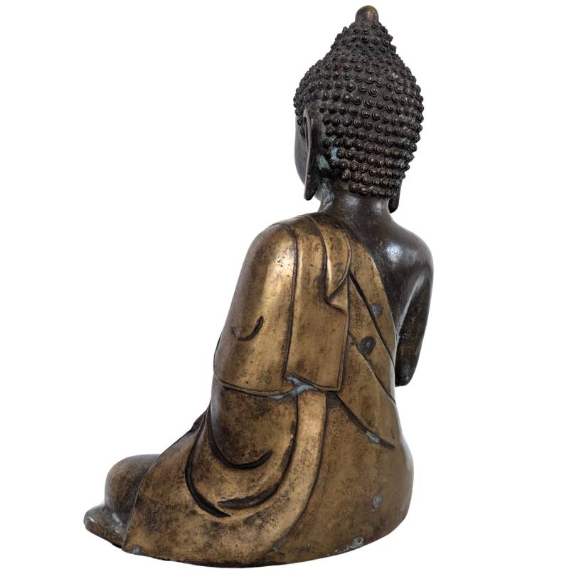 Old Chinese bronze Buddha statue with wear and signs of use
