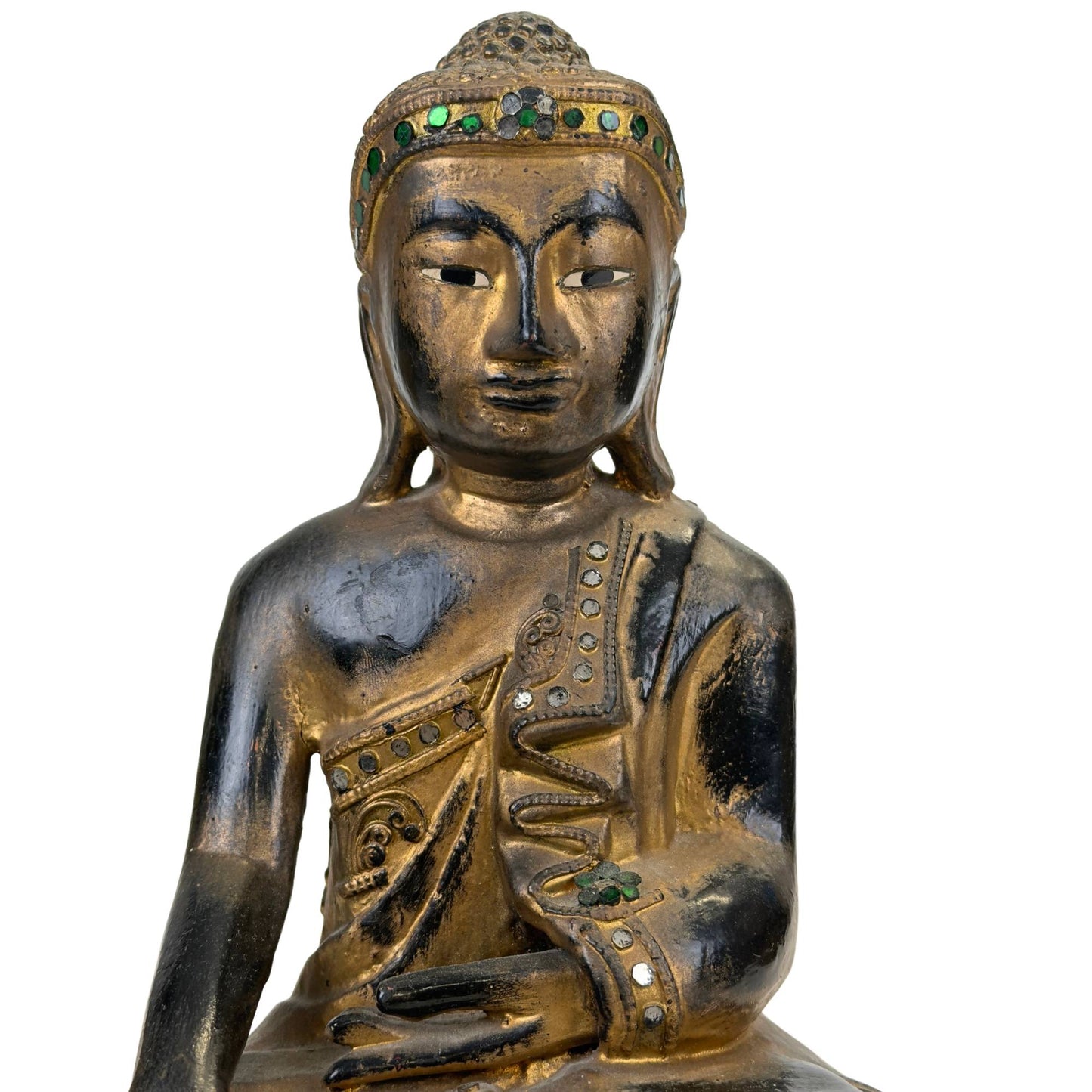 Old wooden Buddha with inlaid glass ornaments