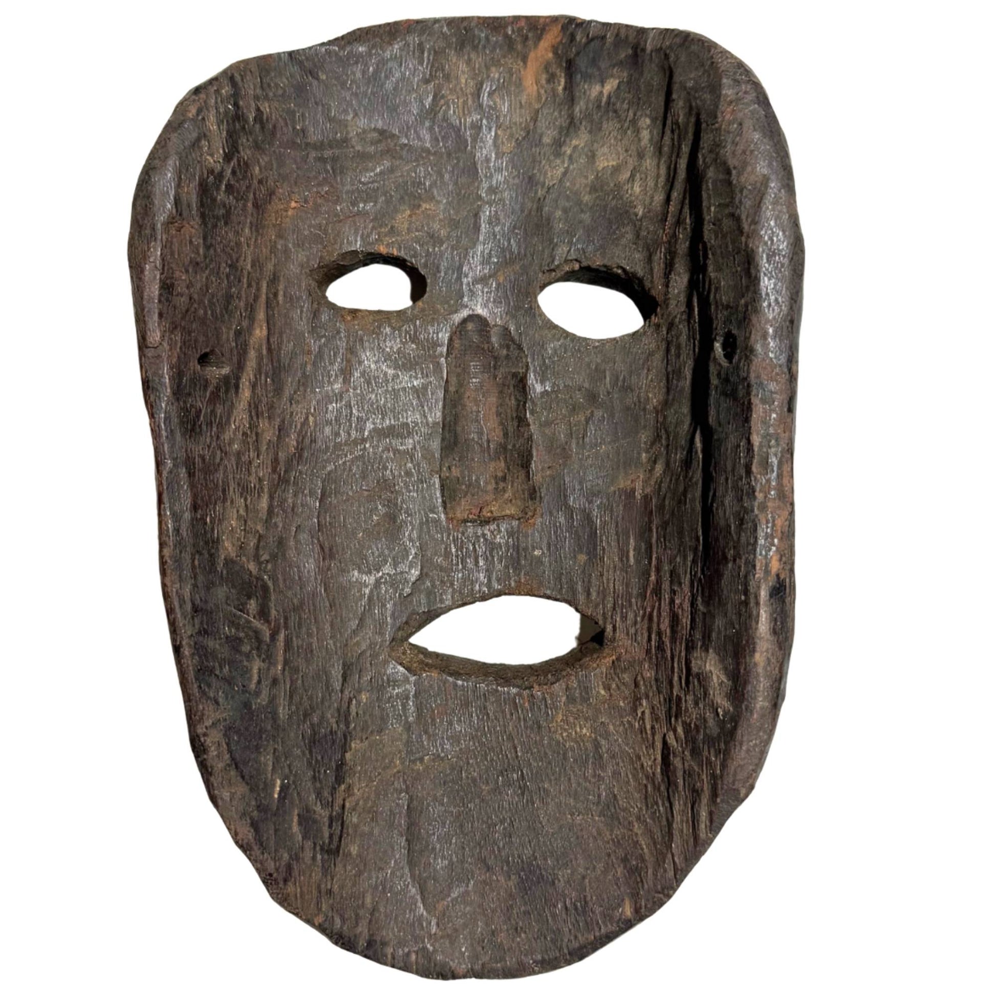 Primitive wooden mask from the Himalayan region, hand-carved ritual object with original mounting holes