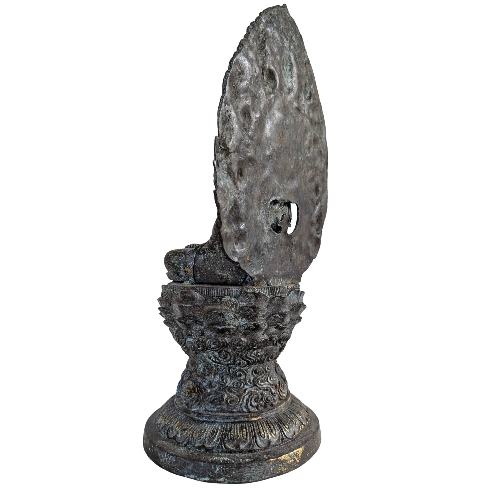 Profile shot of the serene Guanyin figure radiating tranquility in a classical pose.