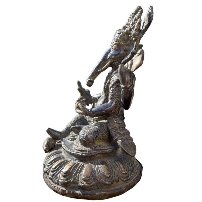 Detailed side view of Ganesha on a lotus throne, crafted in heavy, high-quality bronze.