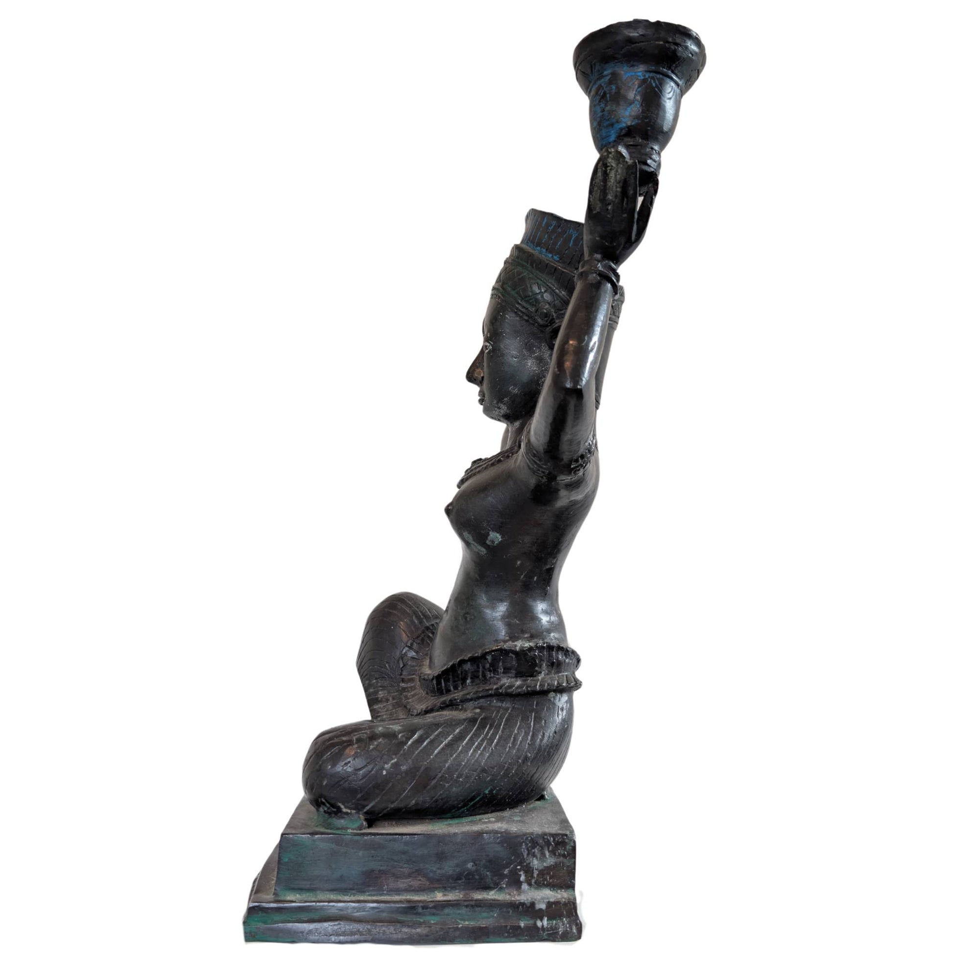 Profile of an Indian Yakshi bronze candlestick