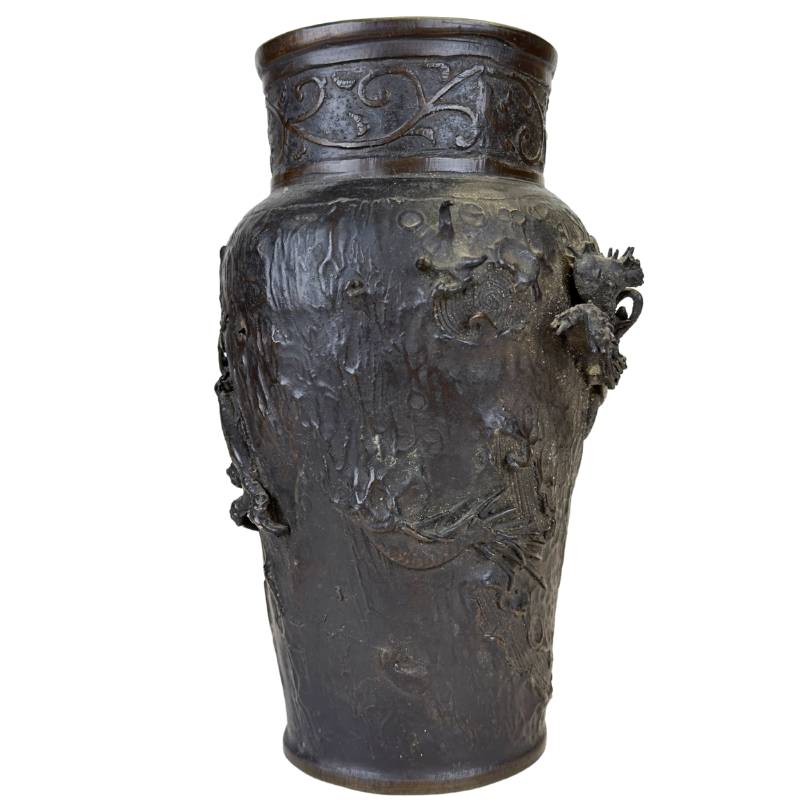 Side view of the dragon clasping the vase, masterful Japanese casting.