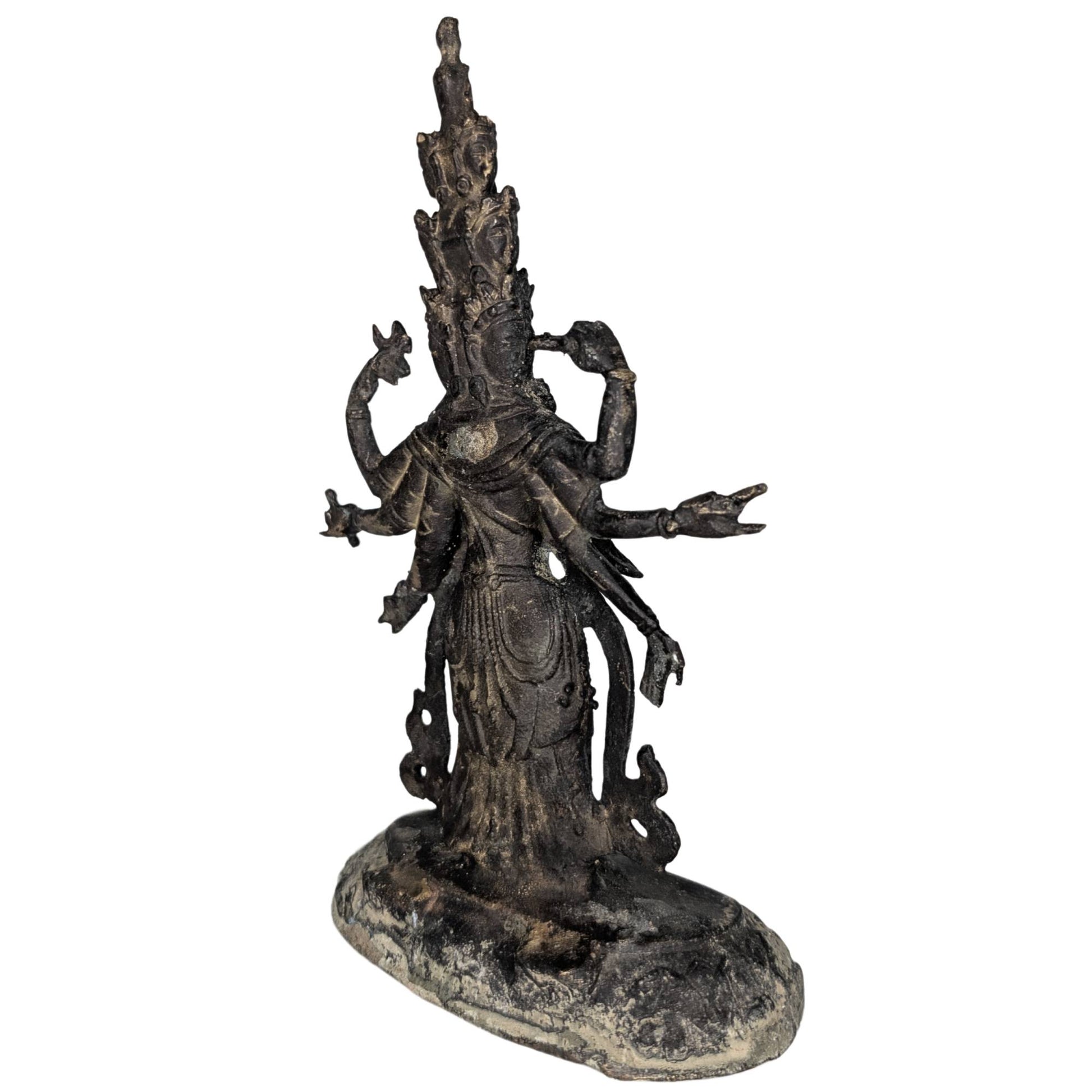 Side view of the Sahasrabhuja figure with multiple heads and spiritual protection.