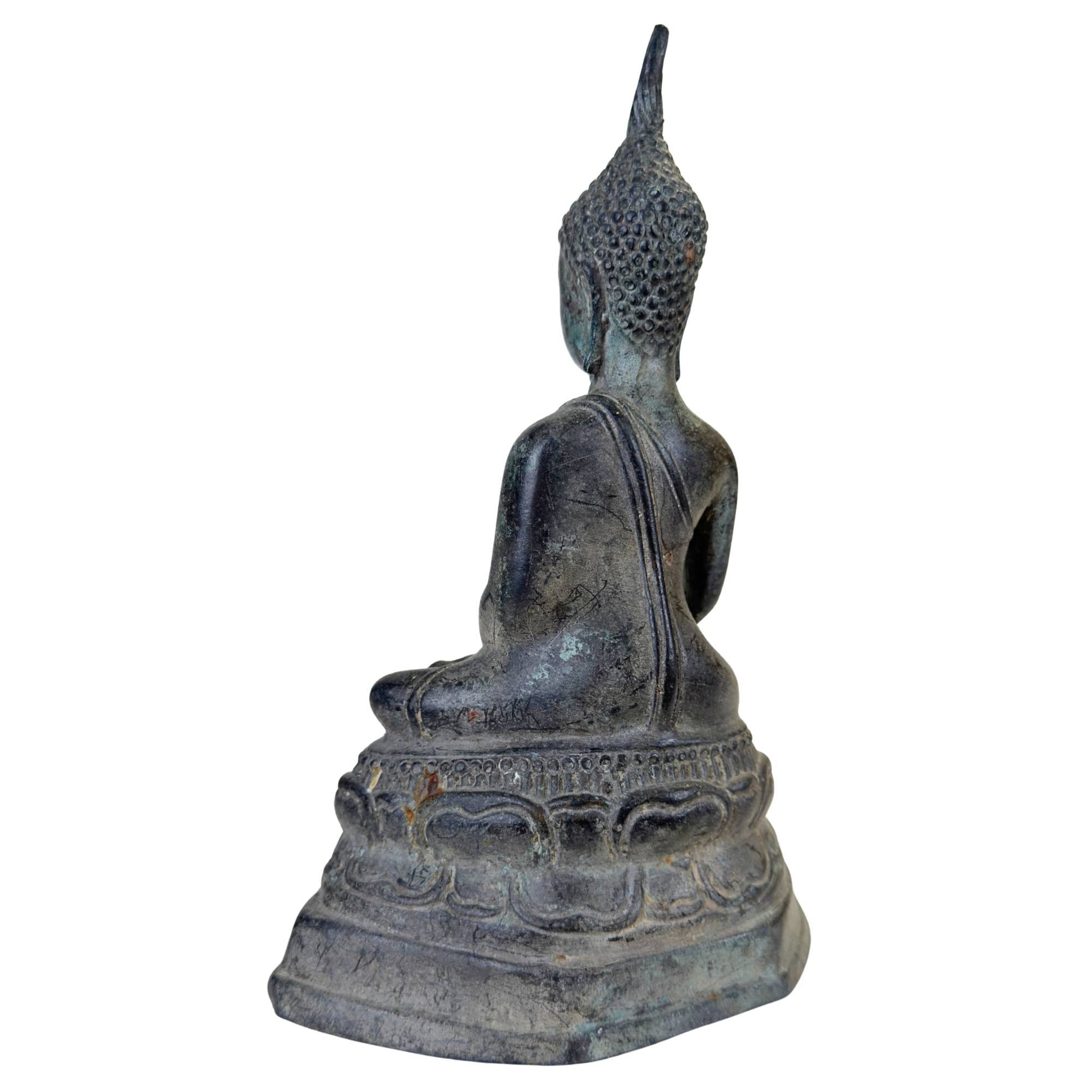 Detail of the richly carved and decorated throne of the seated Buddha.