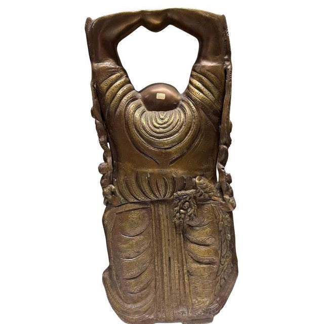 Detail of the richly decorated patterns on the bronze robe.
