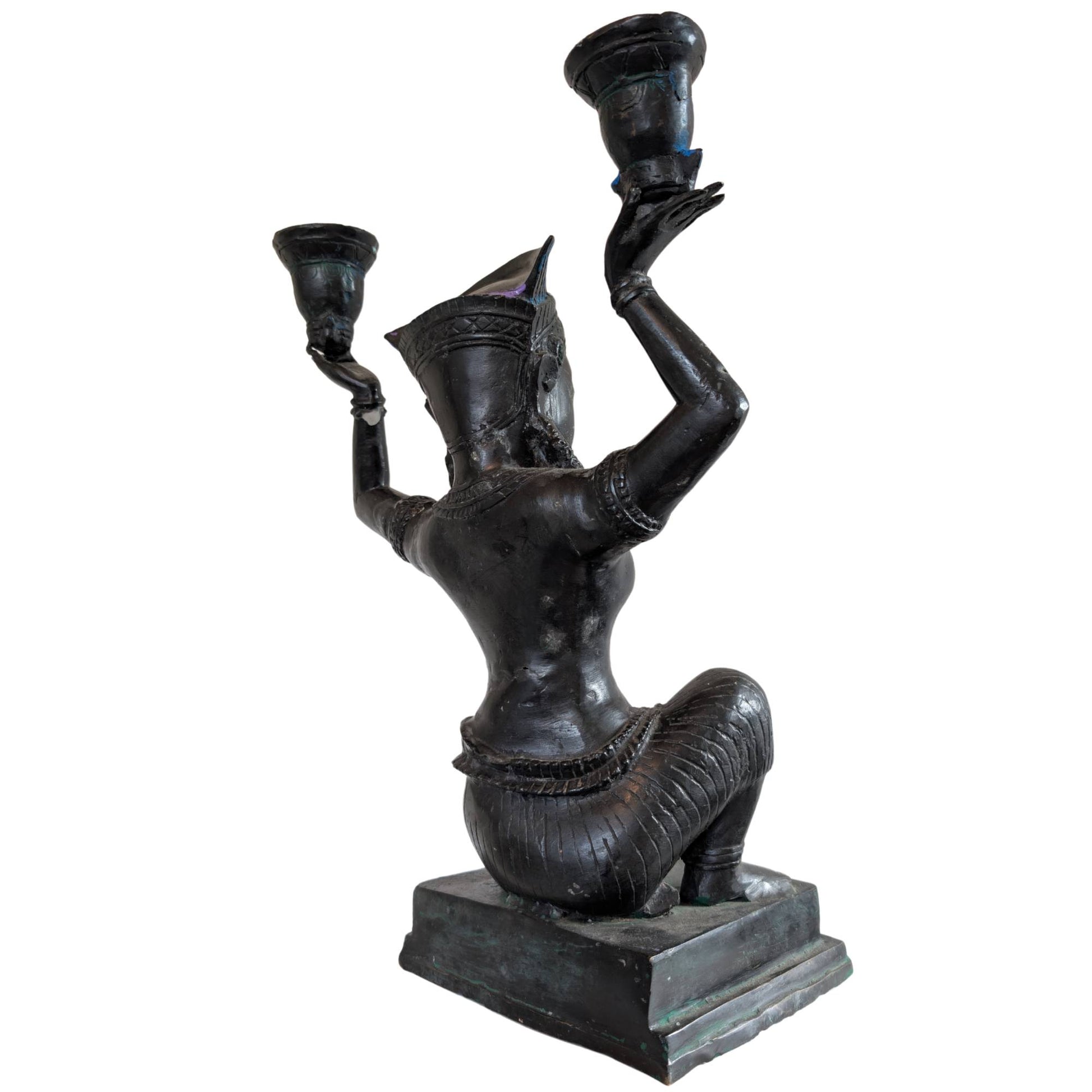 Reverse side of a large bronze candelabra, temple dancer