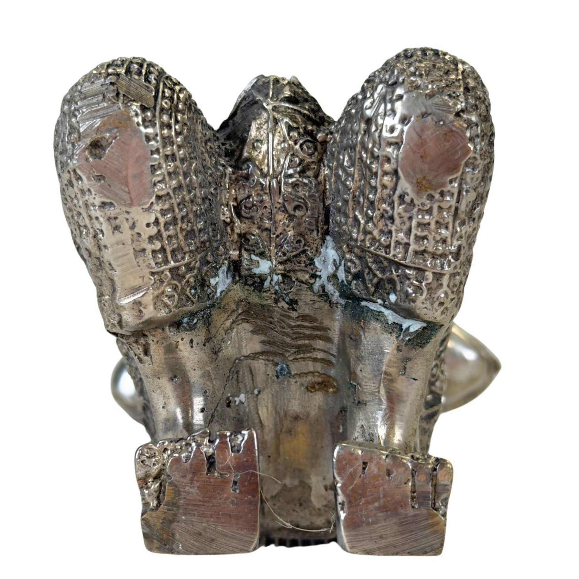 Detailed depiction of the serene gaze of a temple guardian.