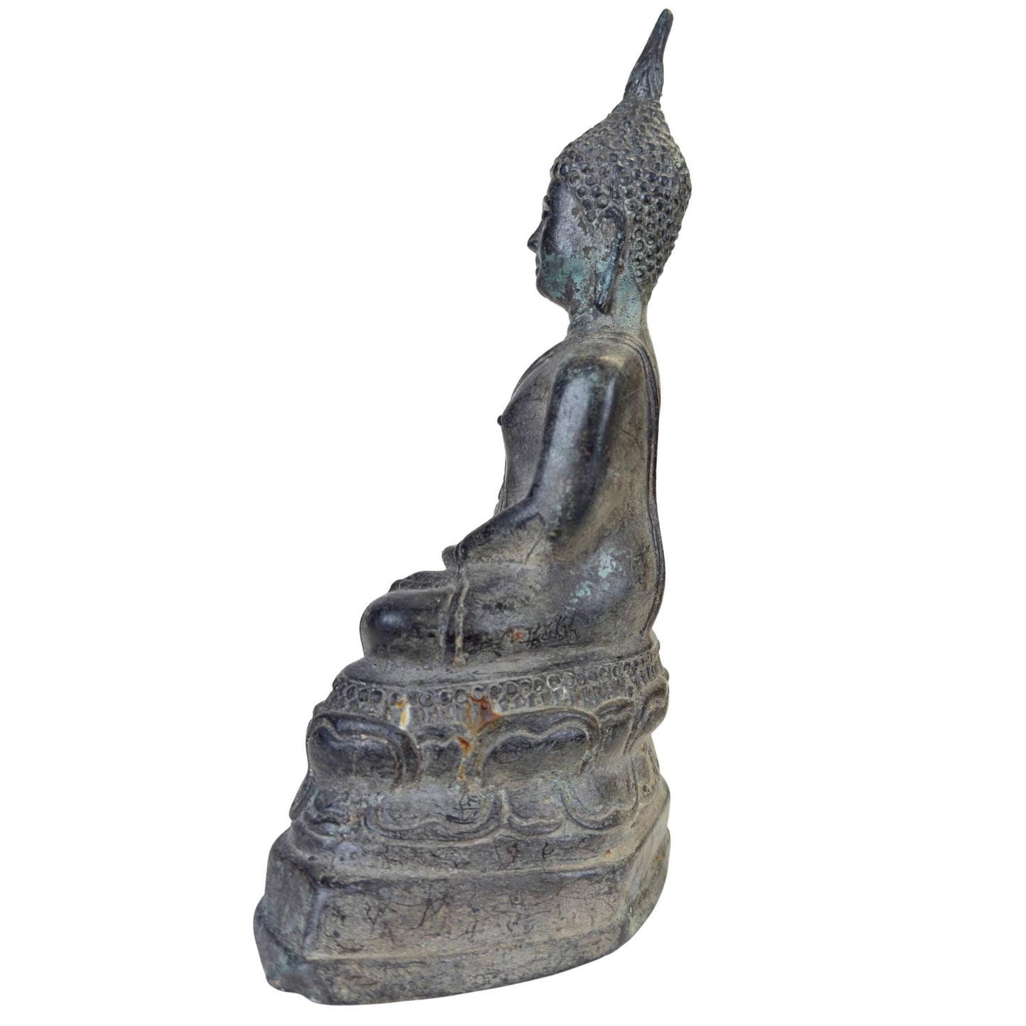 Macro shot of the serene facial features and smile of the Buddha.