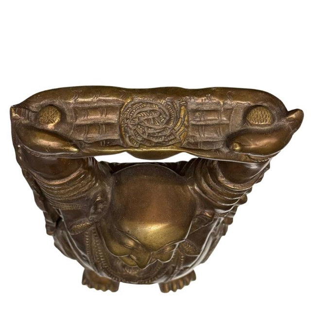 Close-up of the cheerful and serene smile of the Laughing Buddha.