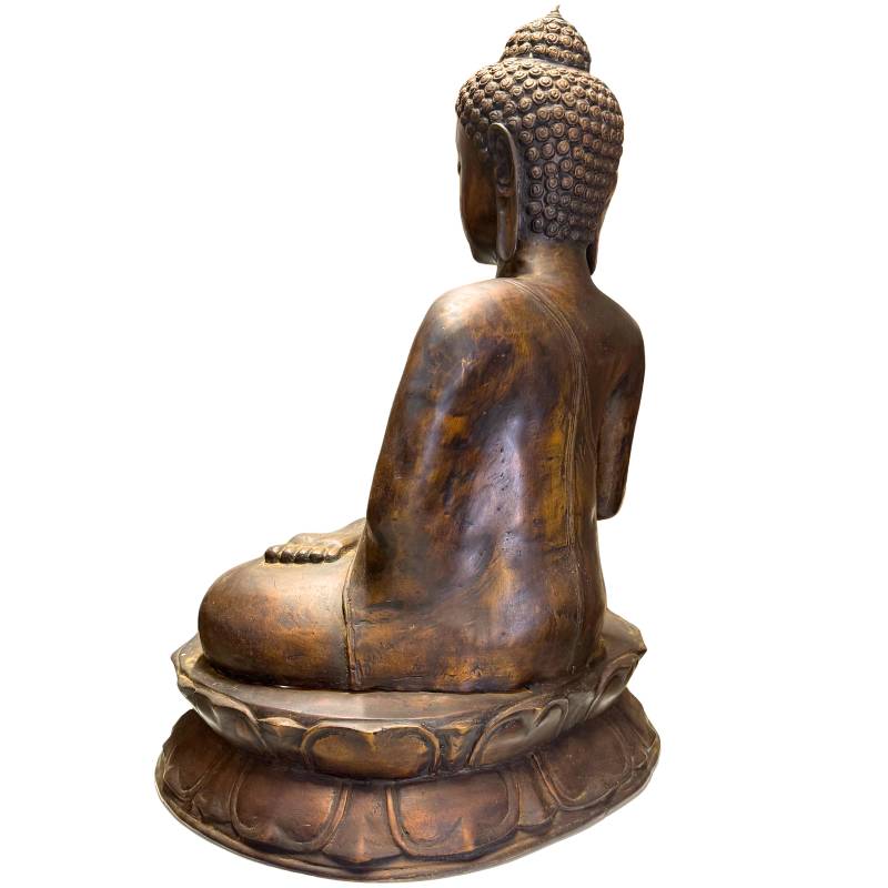 Detail of the serene face and the full forms of the Javanese Buddha.
