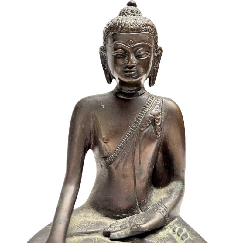 Bronze Shakyamuni Buddha statue with a serene appearance
