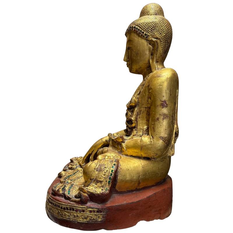 Shakyamuni Buddha of gilded wood with meaning of peace, trust, and inner certainty