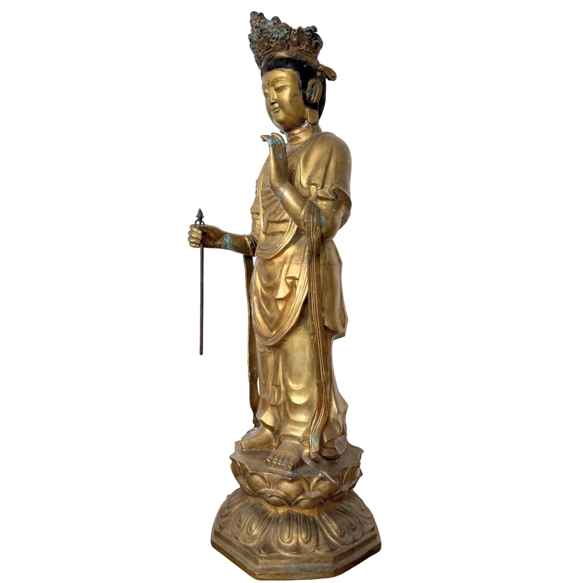 Oblique front view of the Sho-Kannon Bodhisattva, showing the vertical lines and the thin-walled casting of the 23 kg bronze.