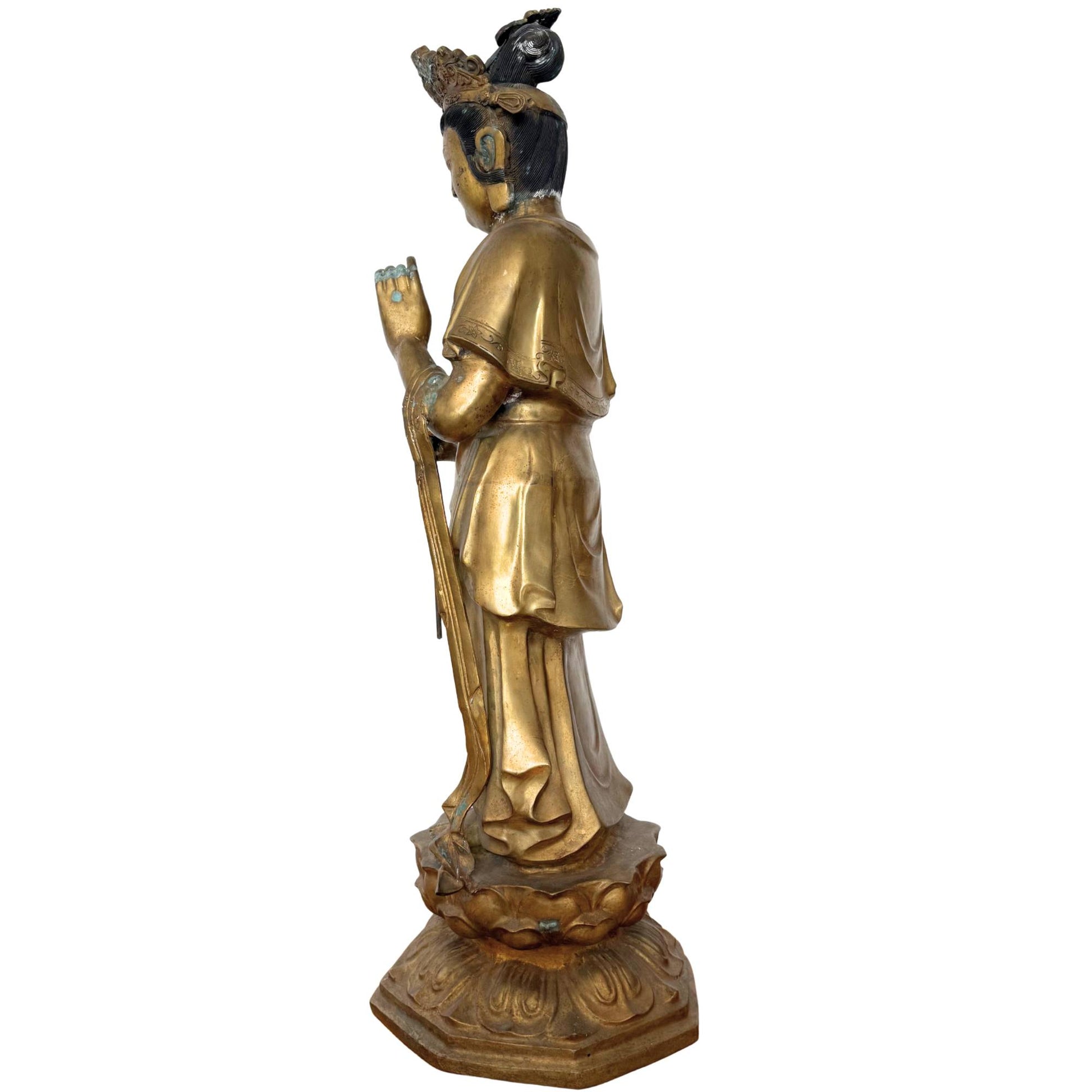 Detail of the rear and side view, showing the flowing drapery of the dhoti and the authentic wear of the gold lacquer.