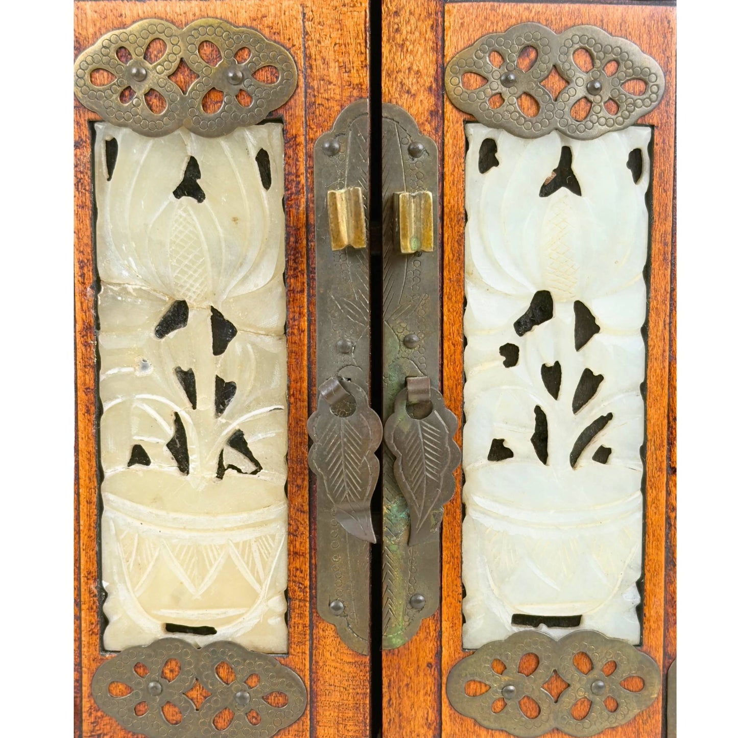 Chinese jewelry box with floral stone panels, hinged doors, and warm wood color