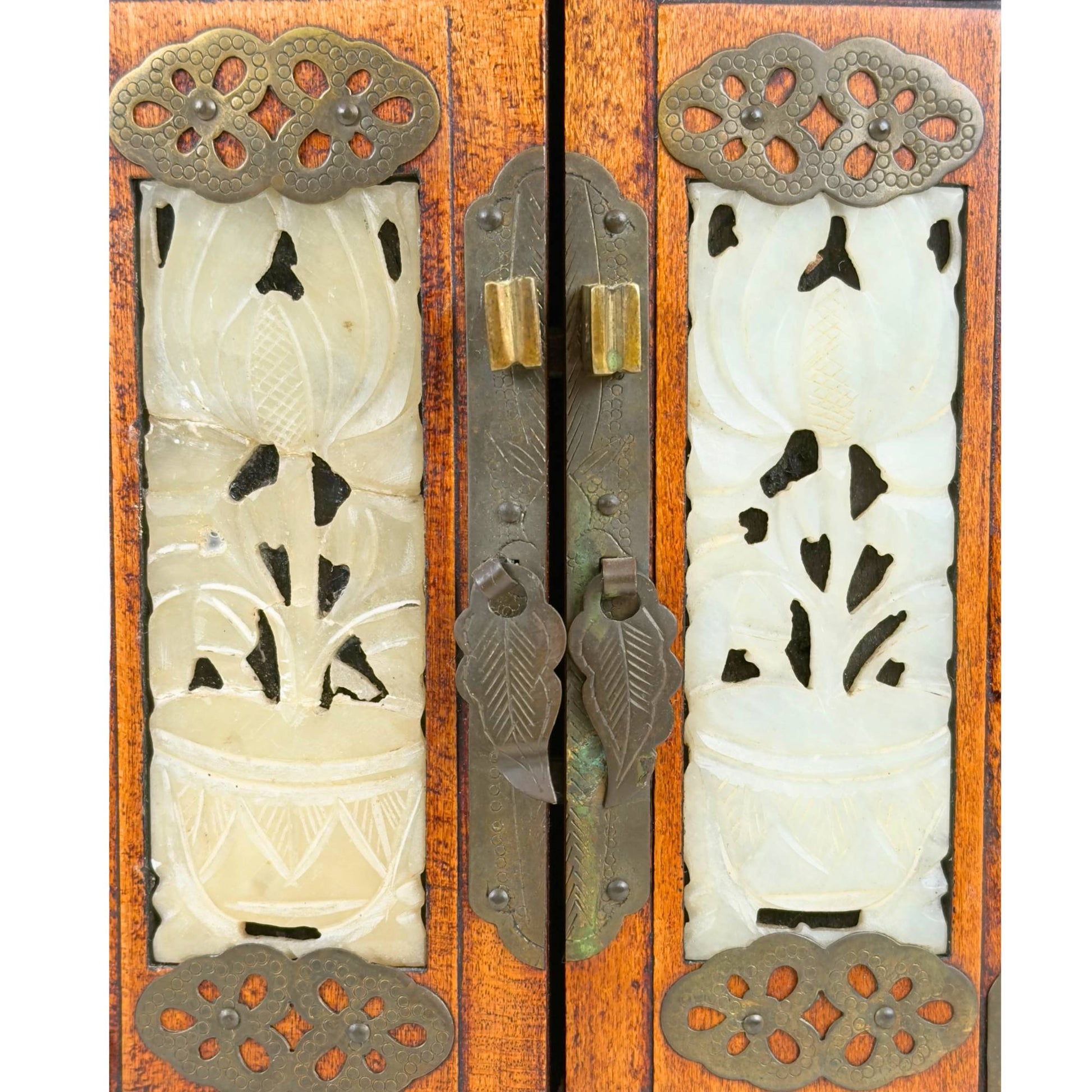 Chinese jewelry box with floral stone panels, hinged doors, and warm wood color