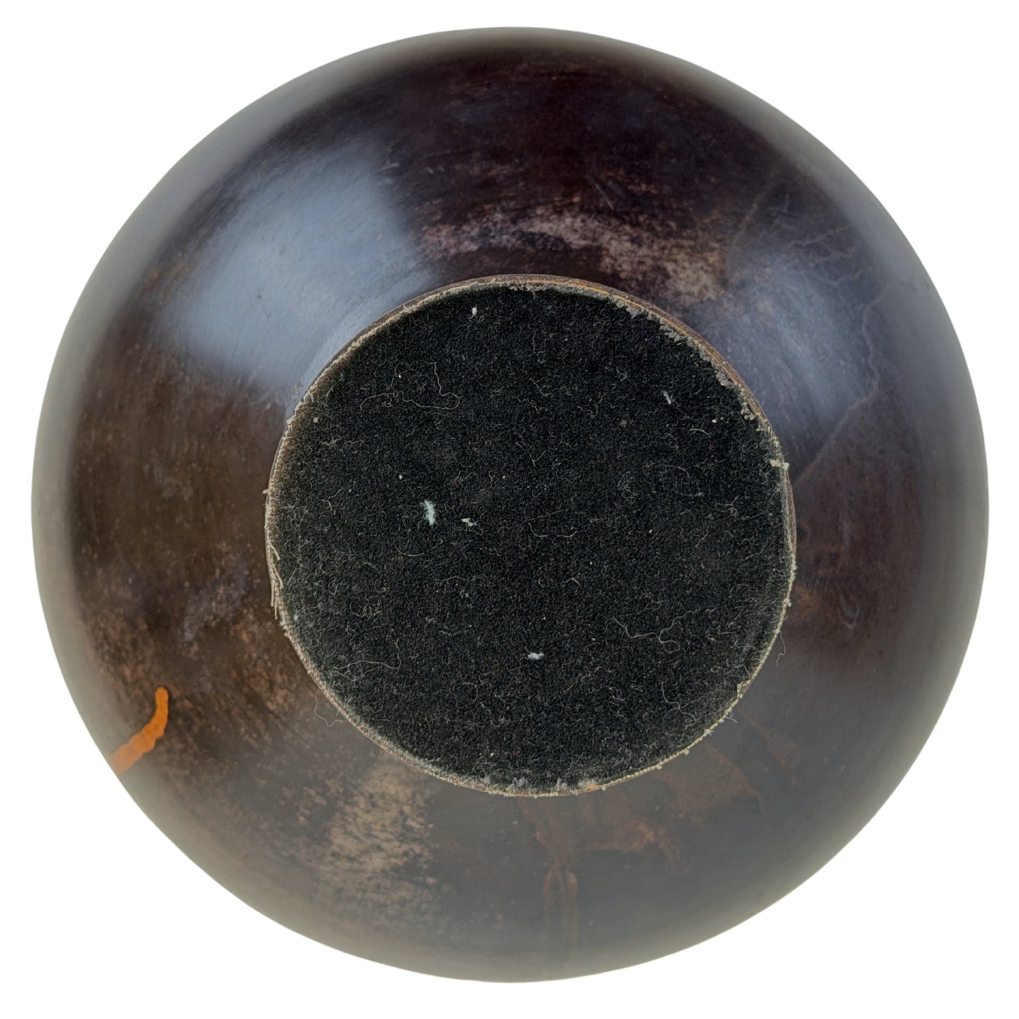 Top view of domed cover A with dark uneven patina