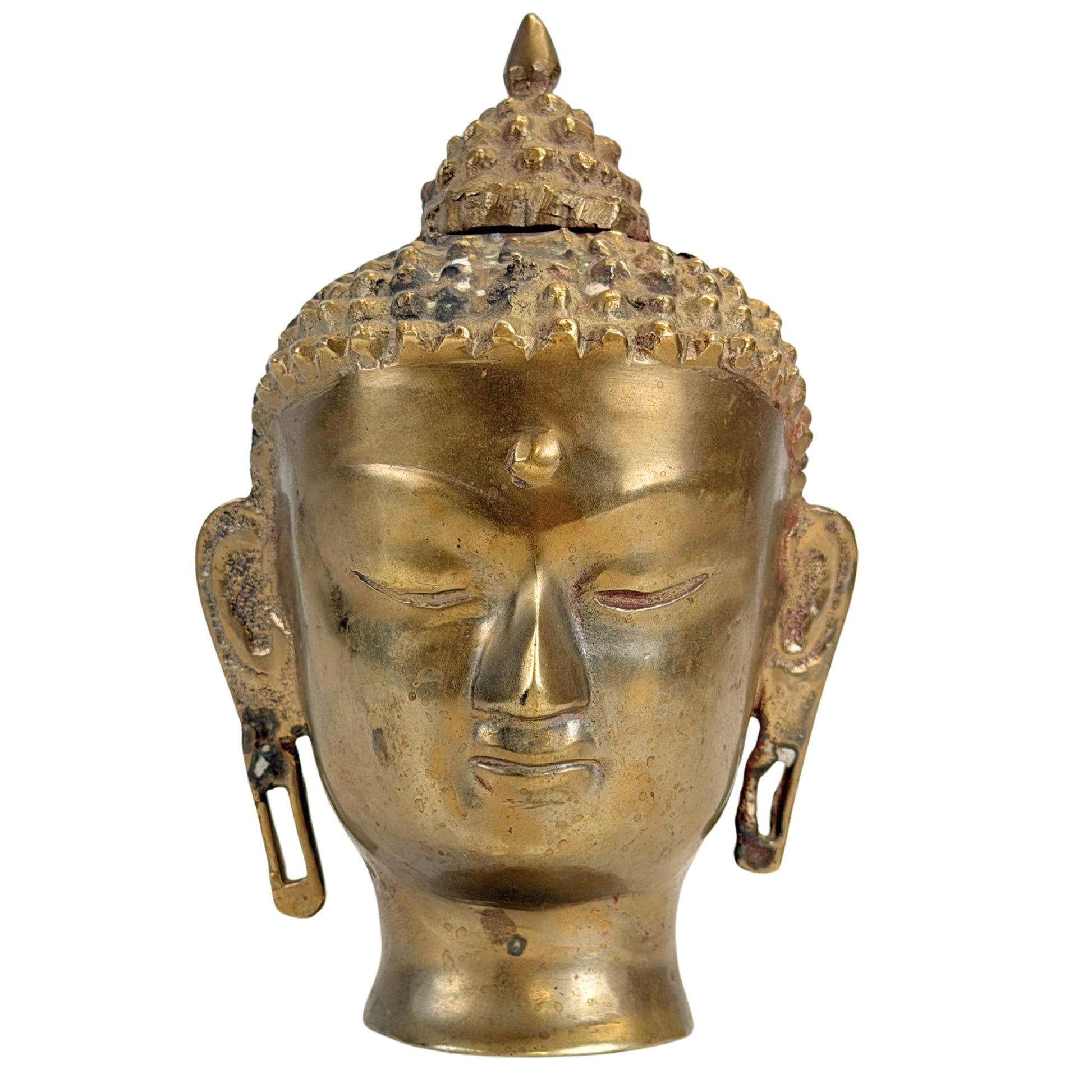Vue de face de la tête de Bouddha en bronze aux yeux sereinement clos