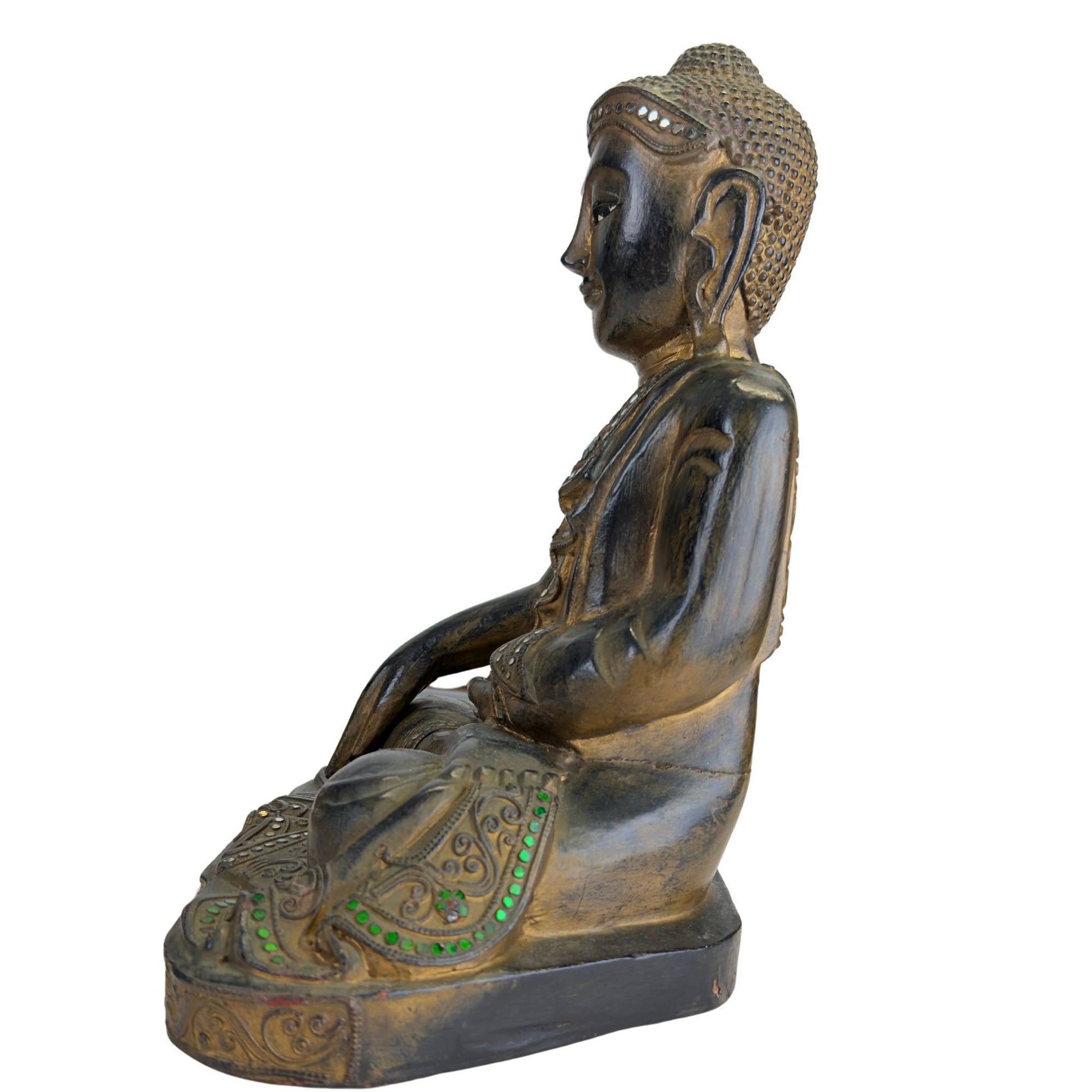Spiritual wooden Buddha in classic Mandalay tradition