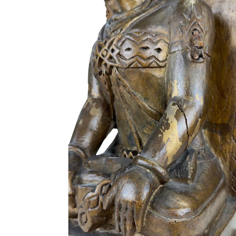 Wooden temple figure Sri Devi with gilding and patina Java
