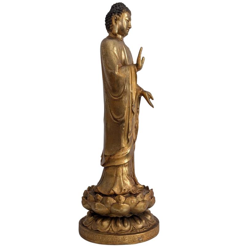 Standing Buddha in gilded bronze from China