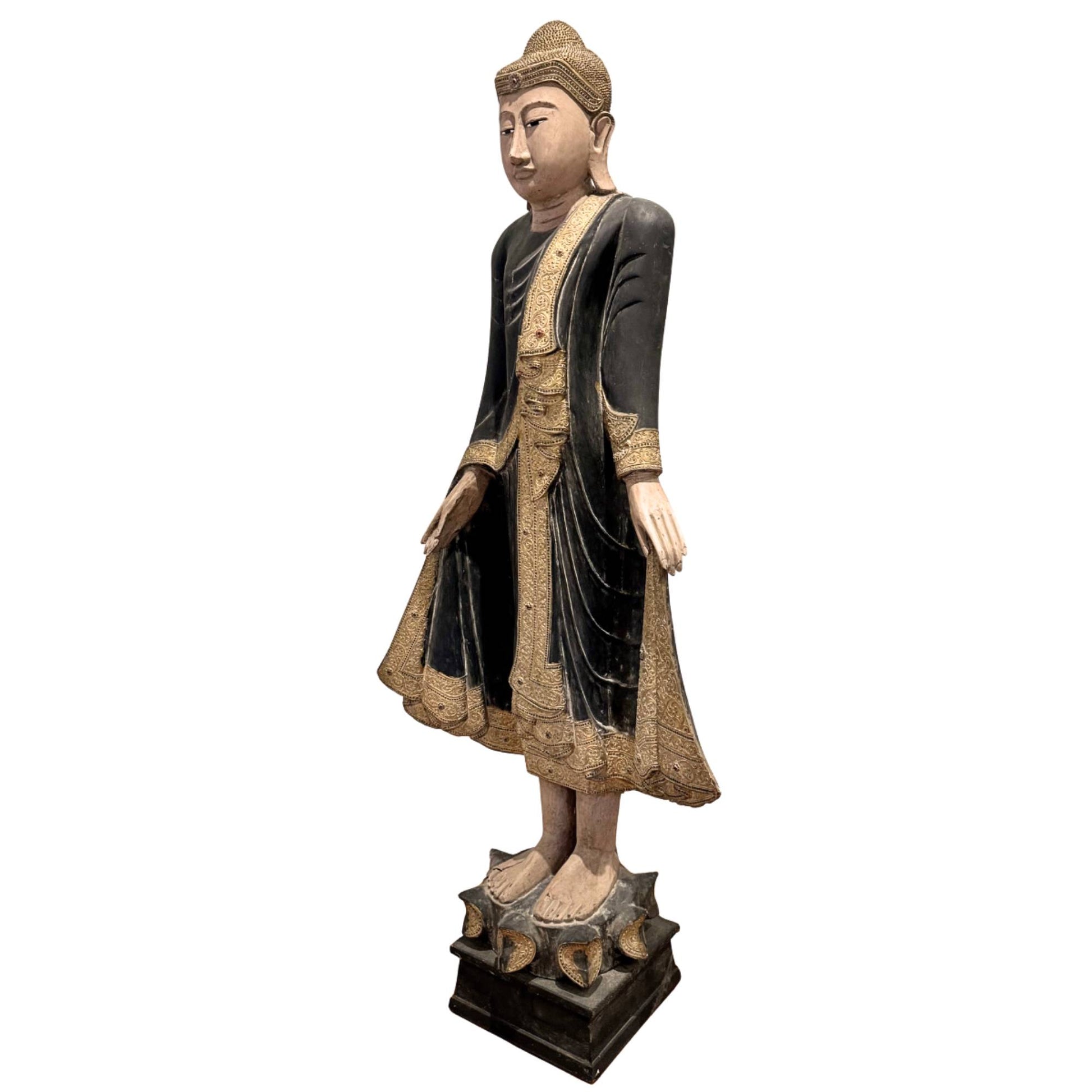 Standing wooden Buddha from the 19th century, large Burmese temple statue with inlaid eyes and spiritual presence