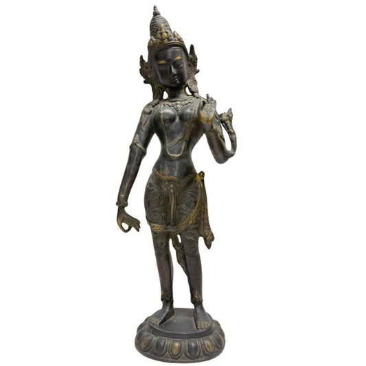 Antique bronze statue of a standing Tara from the Himalayan region.